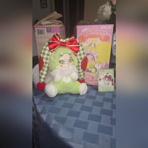Green and Red Boboco Enigma Wonderland Plush Toy with Bow